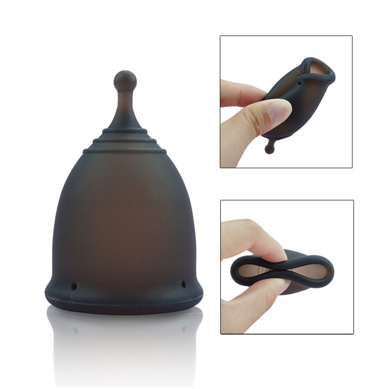 Black menstrual cup with close-up insets showing its use on a white background
