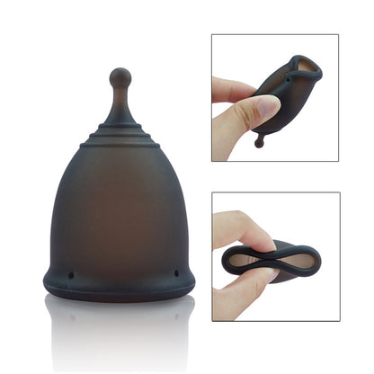Black menstrual cup with close-up insets showing its use on a white background